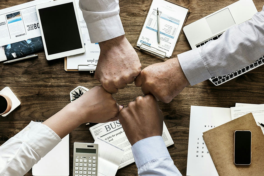 table with group fist bump